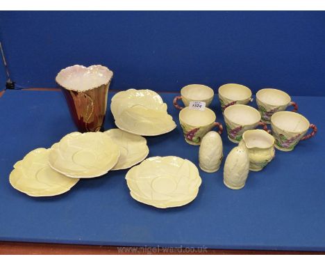 A Carltonware part Teaset in lemon with foxglove design to include six cups (three cups being a/f), six saucers, two salt and