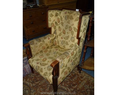 An elegant Mahogany framed light and darkwood strung and cross-banded Wing fireside Chair standing on square legs and upholst