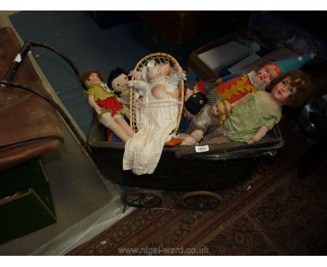 An early 1900's tinplate doll's Pram and vintage dolls.