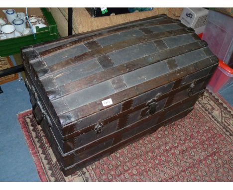 A domed top wooden strip protected Travelling Trunk 32 1/2'' x 18 1/2'' x 21'' high approx.