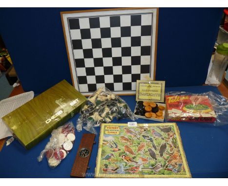 A small quantity of games including Draughts, Tell Me Quiz, Victory jigsaw and small compass in frame.