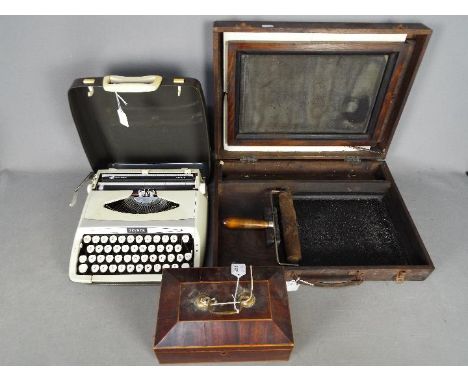 A vintage silk screen duplicator, Zephyr portable typewriter and a wooden box. [3]