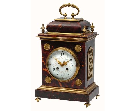 A TORTOISESHELL AND GILT BRASS MOUNTED MANTEL CLOCK the convex white enamel Arabic dial with floral swags, Marti twin train g