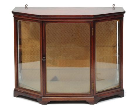 A MAHOGANY AND BOX STRUNG MINIATURE DISPLAY CABINET, with glazed door flanked by glazed canted panels, on bracket feet, 40cm 