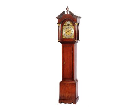 AN OAK EIGHT DAY LONGCASE CLOCK, the 12" brass break arch dial with silvered Roman chapter ring, Arabic five minutes signed J