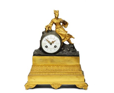 A 19TH CENTURY FRENCH ORMOLU MANTEL CLOCK the convex white enamel Arabic dial decorated with swags, the drum movement with ou