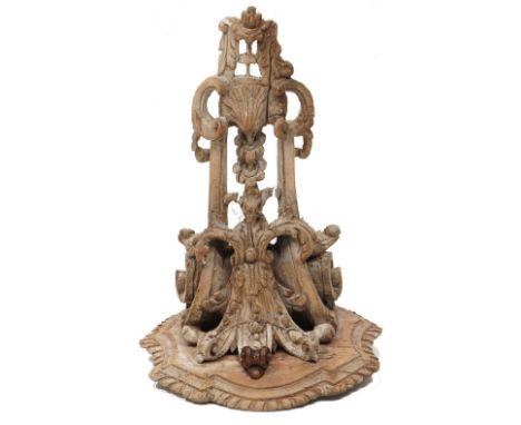 A 19TH CENTURY CARVED WOODEN WALL BRACKET, of classical design, carved with scrolls and foliage and with shaped shelf, 29.5cm