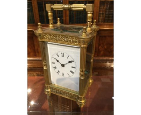 A 19TH CENTURY FRENCH CARRIAGE CLOCK with white enamel Roman dial, replaced platform lever escapement and coiled gong strike,