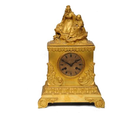 A 19TH CENTURY FRENCH ORMOLU MANTEL CLOCK with silvered engine turned Roman dial and moon hands, the movement with silk suspe