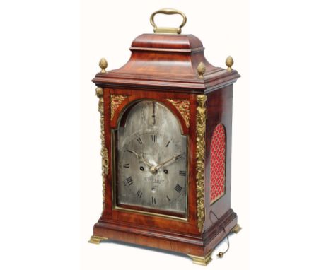 A GEORGE III MAHOGANY BRACKET CLOCK the silvered break arch dial signed Christopher Bullock, London, Roman numerals, Arabic f