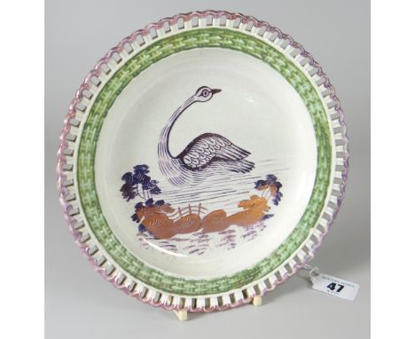 A DILLWYN &amp; CO SWANSEA POTTERY RIBBON PLATE having a basket-weave border painted green and decorated with a swan in a wet