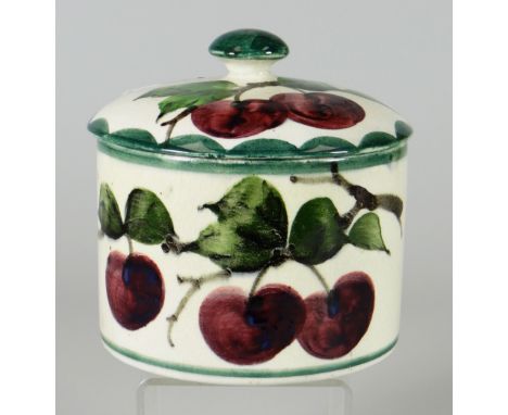 A LLANELLY POTTERY PLUM DECORATED COVERED JAR having a mushroom knop, marked Llanelly in black print, 13cms high Condition Re