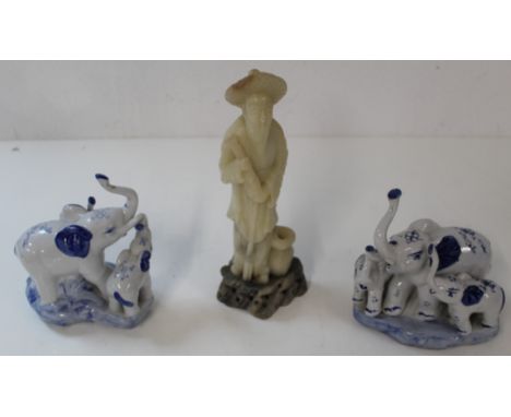 Ceramic elephant figures and onyx figure of an Oriental man&nbsp;