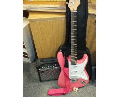 A GEAR4MUSIC PINK ELECTRIC GUITAR WITH AMPLIFIER