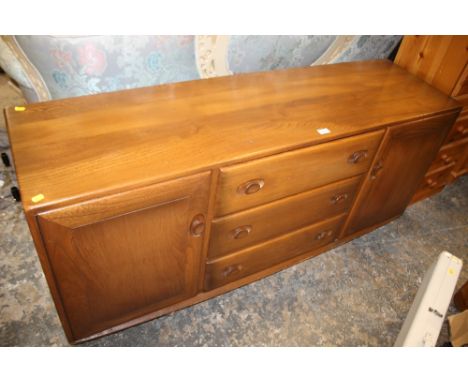 AN ERCOL LOW SIDEBOARD - W 155 CM