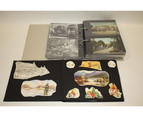 AN ALBUM OF VINTAGE POSTCARDS TOGETHER WITH A SCRAP BOOK