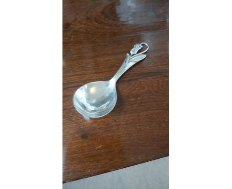 A DANISH SILVER CADDY SPOON, THE FLARED STEM WITH STYLISED SINUOUS FLORAL DECORATION, FIG SHAPE BOWL - HORSEN SOLVVAREFABRIK 