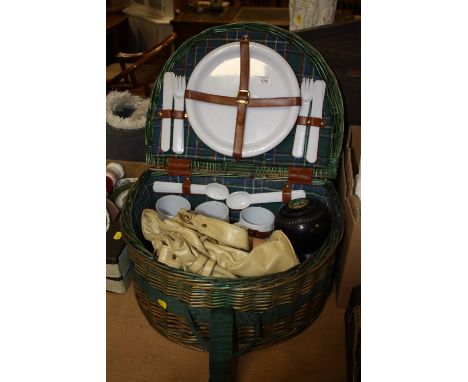 A SEMI-CIRCULAR WICKER PICNIC HAMPER AND CONTENTS TO INC LAWN BOWL