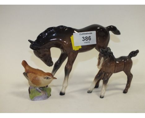 TWO BESWICK FOAL FIGURES TOGETHER WITH A ROYAL WORCESTER WREN FIGURE