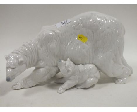 A LARGE NAO POLAR BEAR AND CUB FIGURE