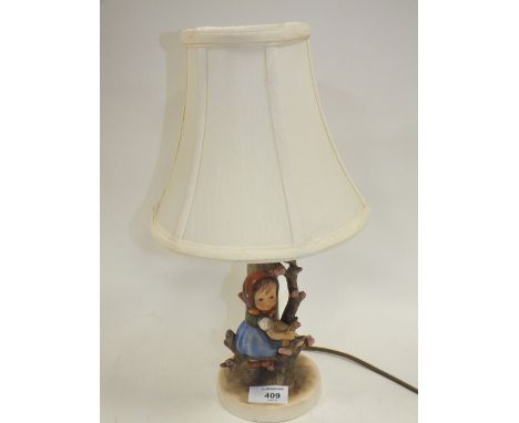 A HUMMEL CERAMIC TABLE LAMP