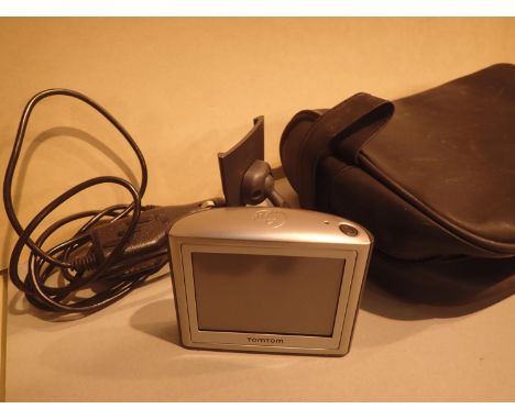 TomTom navigating system and a plug in adapter. P&amp;P Group 1 (£14+VAT for the first lot and £1+VAT for subsequent lots) 