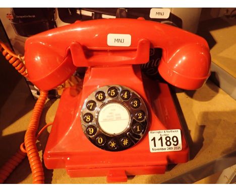 Red, GPO Carrington, push button telephone in 1920s styling with pull-out pad tray; compatible with modern telephone banking 