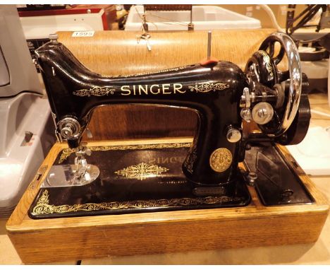 Vintage Singer sewing machine serial no. EA582577 in original wooden case. Not available for in-house P&amp;P, contact Paul O