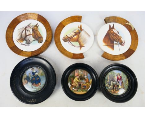 Three oval framed pot ware ceramic pot lids and three oval framed ceramic horse head plates. Largest is 20 cm x 20 cm. Two wo