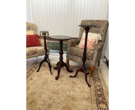 Two torcheres and a plant stand / occasional table on tripod supports, largest approximately 92 cm (h), please note the chair