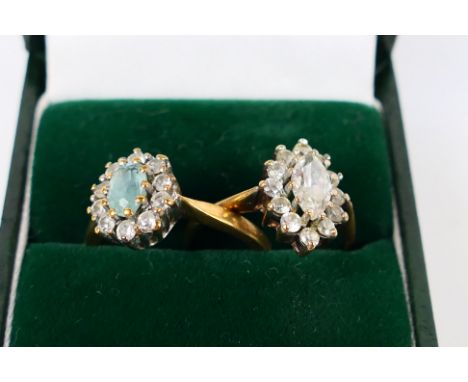 Two 9ct yellow gold cluster rings, one with navette shaped head, size N and the other size N+½, approximately 5.1 grams. [W]