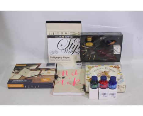 Calligraphy - An assortment of Calligraphic items such as two sets which include ink, nibs, and pens. Three 30 ml jars of cal