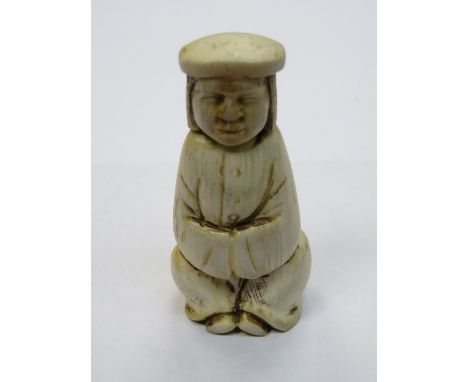 CARVED IVORY NETSUKE WITH NODDING HEAD, SIGNED TO BASE, APPROXIMATELY 6.5cm HIGH 