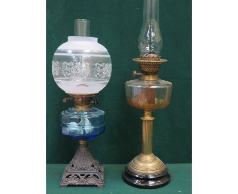 TWO VINTAGE OIL LAMPS WITH COLOURED GLASS RESERVOIRS 