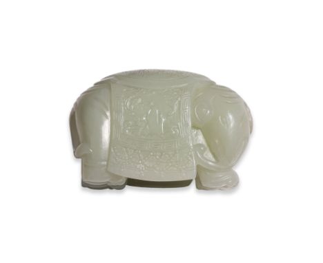 A JADE CARVING OF AN ELEPHANT
Even-toned celadon jade modelled as a standing elephant with head turned, draped in a saddle bl