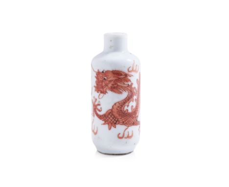 AN IRON RED 'DRAGON' DECORATED PORCELAIN SNUFF BOTTLE
19th/20th Century, cylindrical form with short waisted neck, decorated 