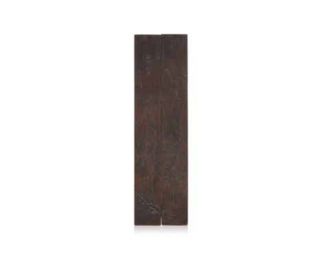 A PAIR OF INCISED BRONZE SCROLL WEIGHTS
Late Qing, flattened rectangular form, decorated with incised scene of a warrior ridi