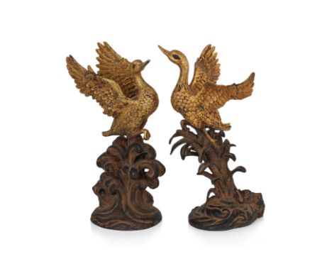 A PAIR OF PARCEL GILT BRONZE MODELS OF GEESE
Japanese, modelled as geese taking flight, one example from waves and the other 