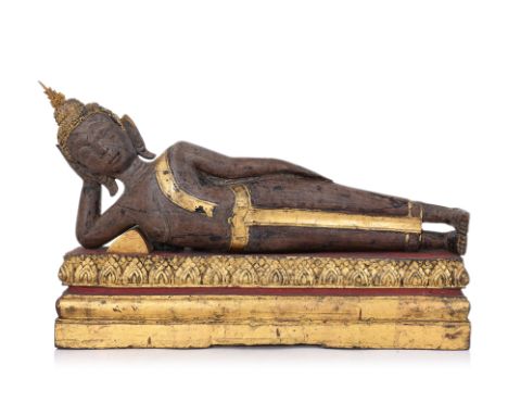 A THAI CARVED SANDALWOOD FIGURE OF RECLINING BUDDHA
Ayutthaya style 18th/19th century, modelled reclining in 'Parinirvana' po