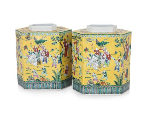 A PAIR OF LARGE HEXAGONAL YELLOW GROUND FAMILLE ROSE PORCELAIN TEA CADDIES
20th Century, decorated with a continuouos scene o