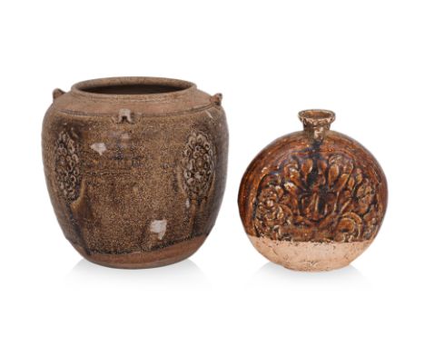 AN AMBER-BROWN GLAZED JAR AND FLASK
Tang dynasty, a large thinly potted ovoid stoneware jar with wide inverted mouth, decorat
