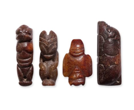 A GROUP OF FOUR NEOLITHIC STYLE JADE CARVINGS
A russet-toned carving of a recumbent pig, two Hongshan type anthropomorphic ca