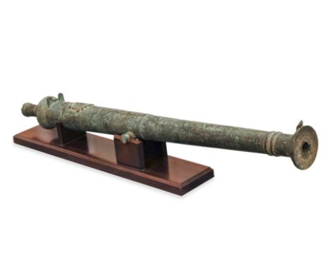 A LARGE SOUTHEAST ASIAN BRONZE 'LANTAKA' CANNON
Circa 18th/19th Century, cast with an indistinct armorial to one end, on cust