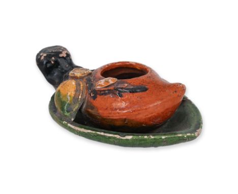 A PEACH-FORM SANCAI GLAZED BRUSH WASHER
Earthenware with green, amber-brown, yellow and dark-brown glaze, modelled as a leaf 