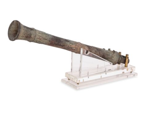 A SOUTHEAST ASIAN BRONZE 'LANTAKA' CANNON
Indonesia or Malaysia, 17th/18th century, portable swivel cannon, decorated along t