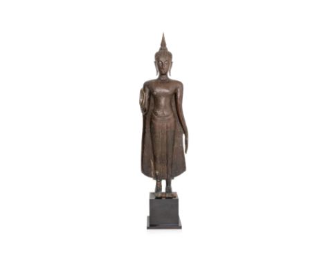 A VERY LARGE THAI BRONZE FIGURE OF BUDDHA Kamphaeng Phet style, 17th Century or earlier,  Modelled standing, nearly life-size