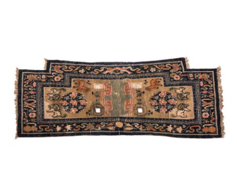 A TIBETAN SADDLE RUG WITH SNOW LIONS AND DEER
1st half 20th century, hand-knotted wool in blue and beige tones, each side wit