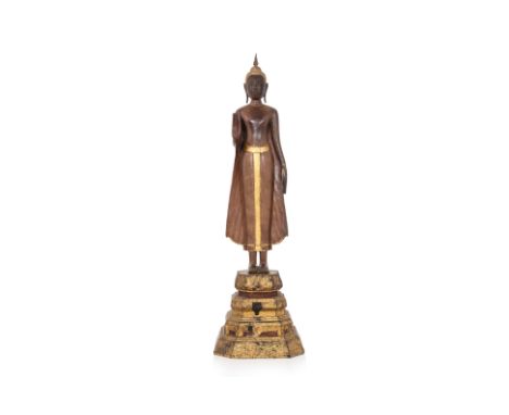 A LARGE THAI CARVED SANDALWOOD FIGURE OF BUDDHA
Ayutthaya style, 18th/19th Century, 
Well carved, modelled standing, the righ