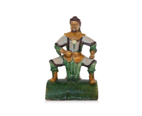 A SANCAI-GLAZED 'WARRIOR' ROOF TILE
Stoneware modelled as a warrior in armour, holding a stern expression and clenched fists,