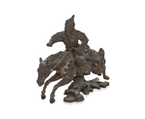 A LARGE BRONZE STATUE OF A WARRIOR ON HORSEBACK
20th Century, hollow cast, modelled leaping over a log, areas of verdigris an